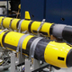 A pair of unmanned underwater vehicles in a lab at the Naval Undersea War Center
